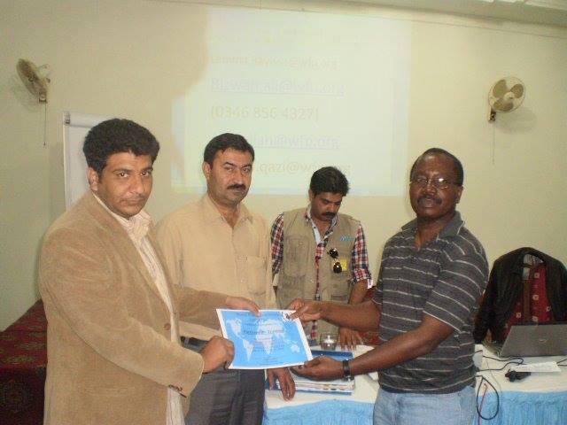 Cheque handover ceremony with international partners